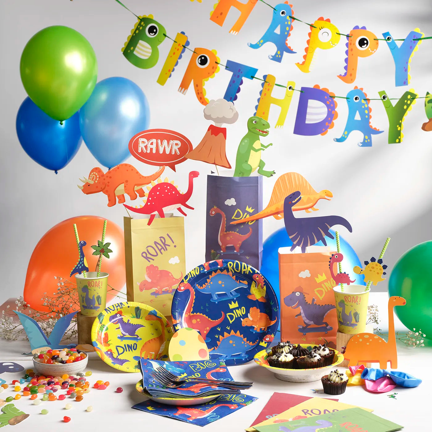 Kids Birthday Party Pack with a Dinosaur Theme. Includes a plastic Table Cloth, Paper Cups and Napkins, Paper Decorative Straws, Disposable Paper Plates, Photo Booth Props x25pcs, Happy Birthday Bunting Banner, fun Stickers and Paper Party Bags with Gifts inside, Party Balloons, Kids Party Games.