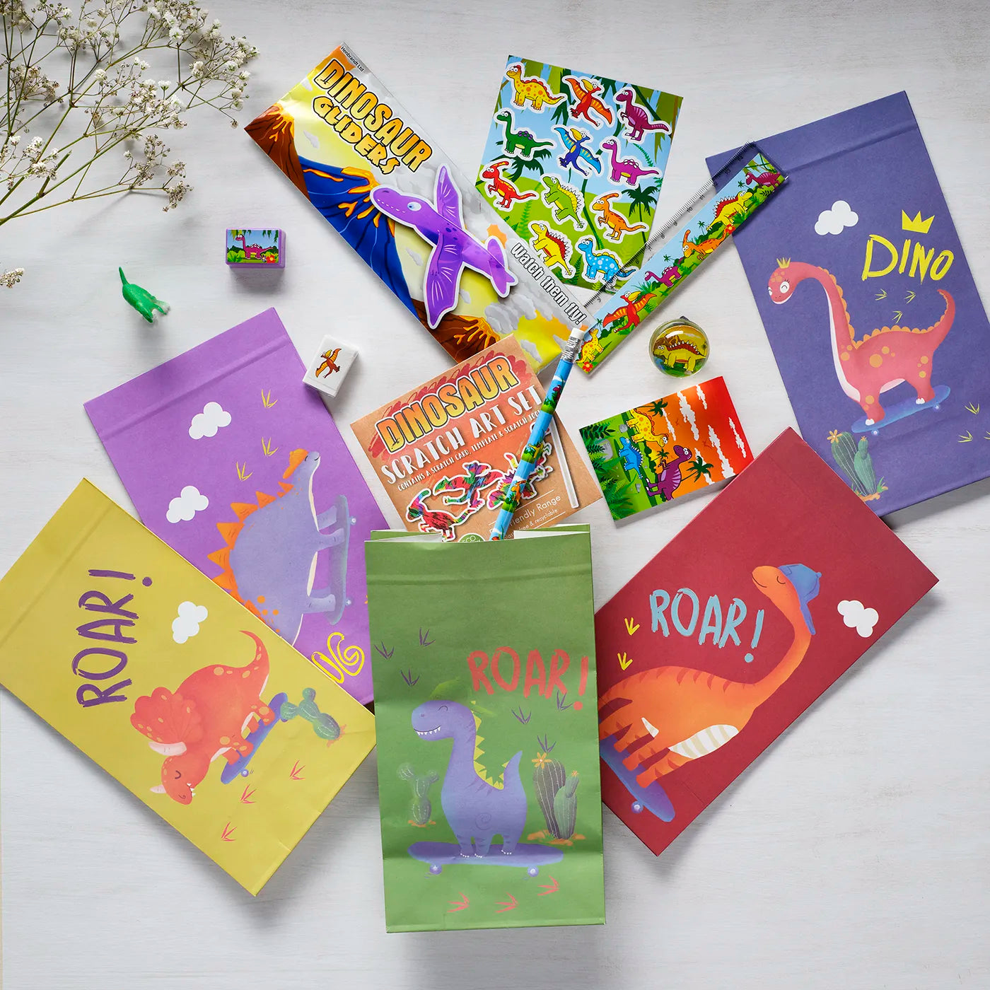 Kids Birthday Paper Party Bags with a Dinosaur Theme. Includes stickers and children’s Party Gifts inside.