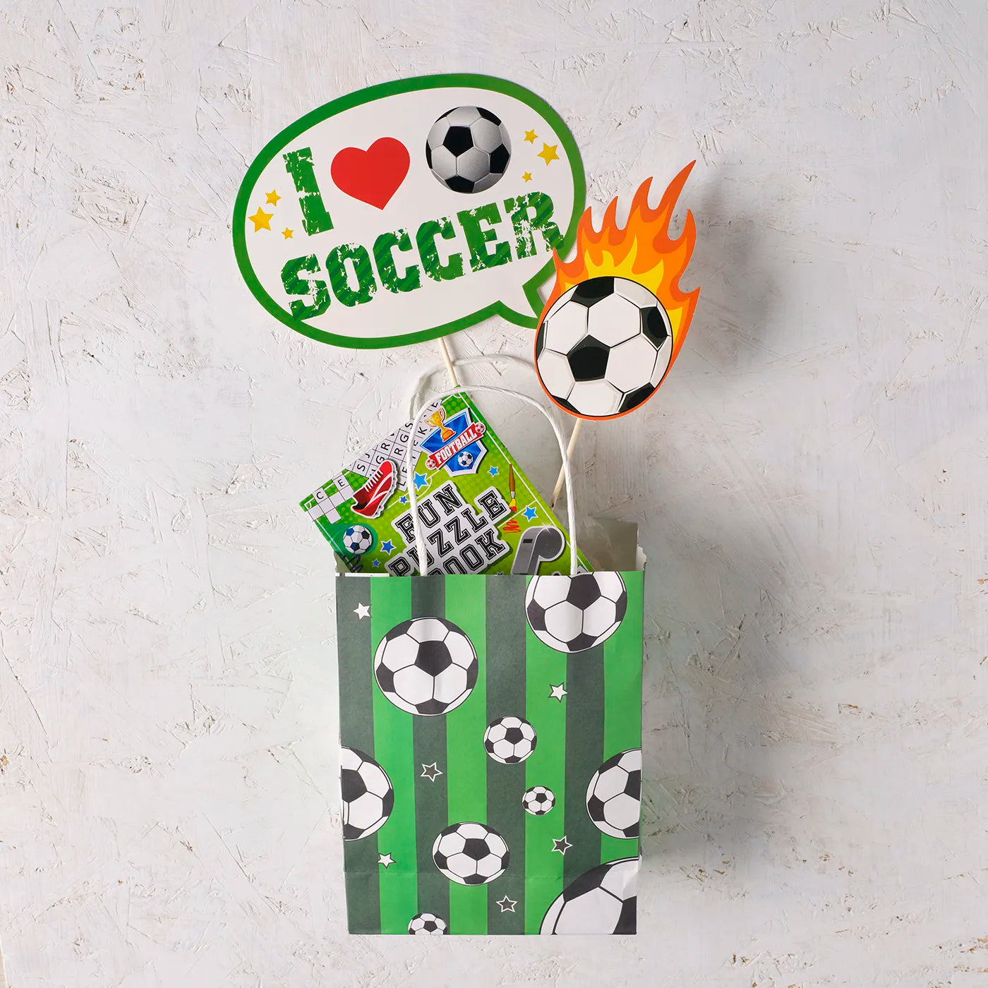 Kids Birthday Paper Party Bags with a Football Theme. Includes stickers and children’s Party Gifts inside.