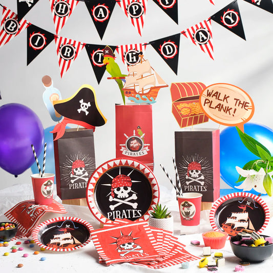 Kids Birthday Party Pack with a Pirates Theme. Includes a plastic Table Cloth, Paper Cups and Napkins, Paper Decorative Straws, Disposable Paper Plates, Photo Booth Props x25pcs, Happy Birthday Bunting Banner, fun Stickers and Paper Party Bags with Gifts inside, Party Balloons, Kids Party Games.