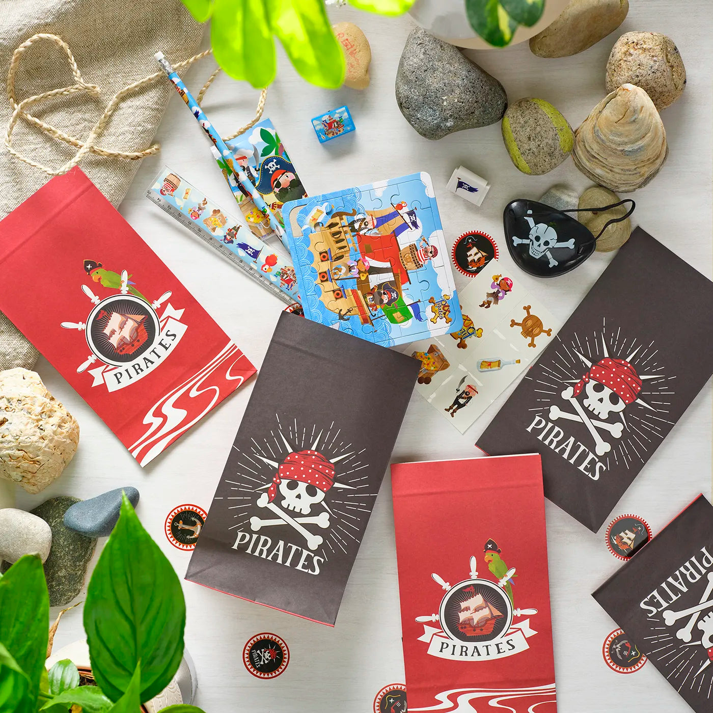 Kids Birthday Paper Party Bags with a Pirate Theme. Includes stickers, pencil, ruler, puzzle and other children’s Party Gifts inside.